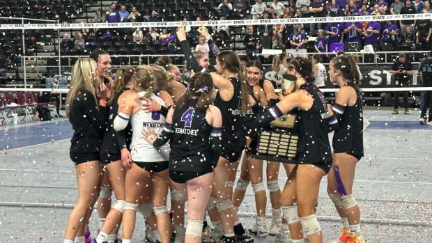 Wenatchee players celebrate after defeating North Creek to win the Class 4A state championship Saturday night in the Yakima Valley SunDome.